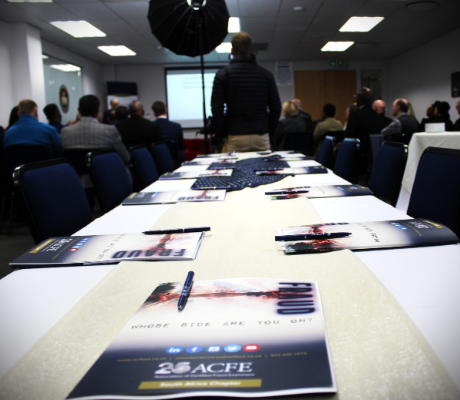 A view of the table that was prepared for the signing with the ACFE SA Training Room in the background.